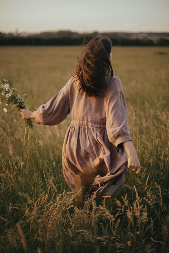 Woman In Field After Colon Hydrotherapy